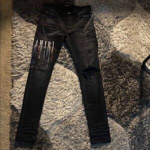 Amiri Black Jeans with Artistic Color Design.